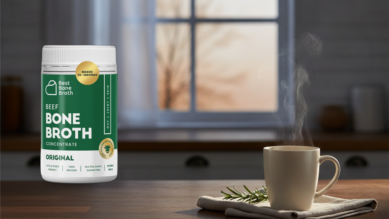 Best Bone Broth Original Beef concentrate bottle beside a warm mug on a calm evening kitchen counter.